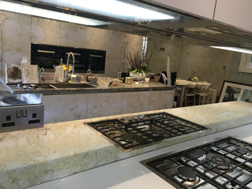 Mirror glass splashback in Barnes luxury kitchen