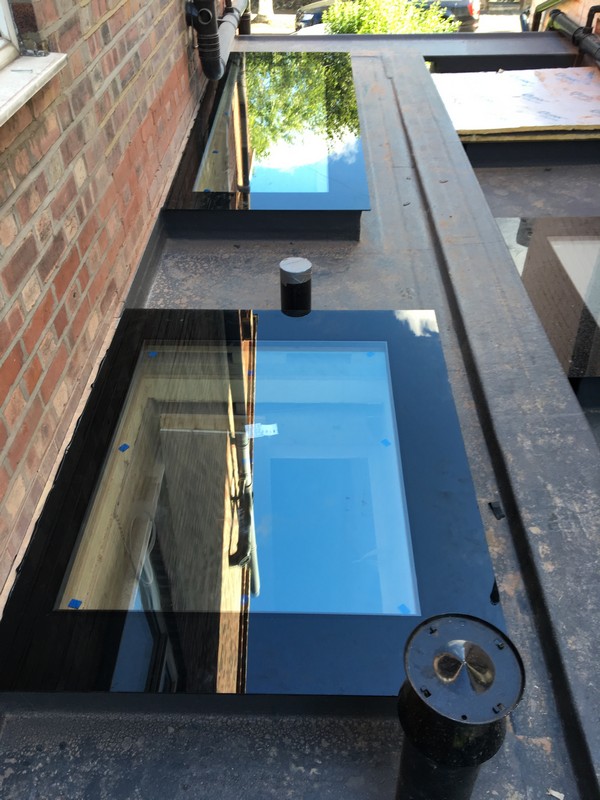 Multiple flat roof skylights on extension in Barnes