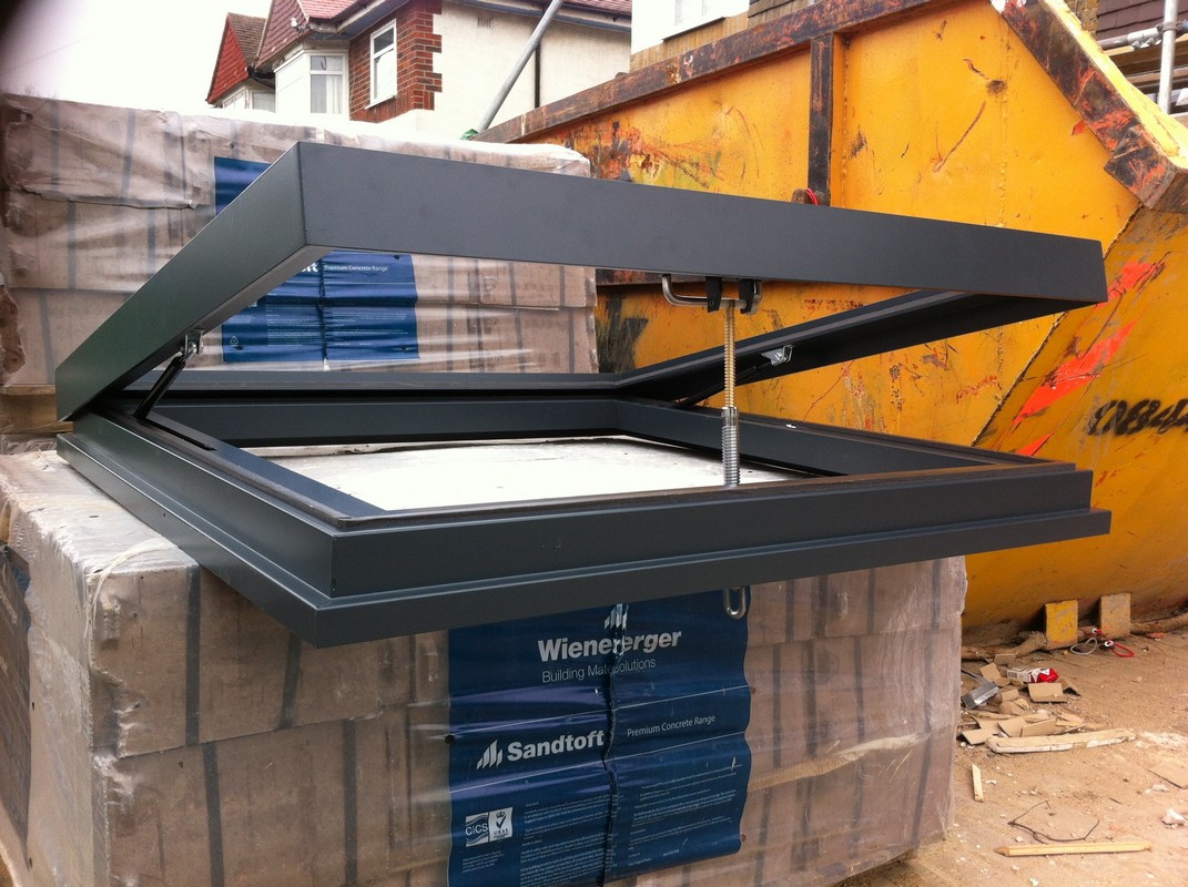 Opening flat roof skylight in anthracite grey installed in Barnes